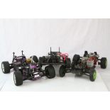 Three fuel remote control car chassis to include a Cen Racing and two Kyosho.