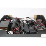 A collection of remote control car quick starter units and battery chargers.