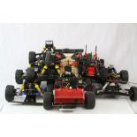 Six early Tamiya remote control car chassis.