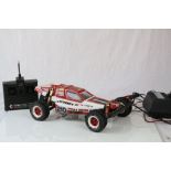 Kyosho Optima Turbo electric remote control car from the 1980's together with Futaba remote control,