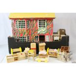 Mid 20th C tin plate dolls house with a quantity of contemporary wooden furniture