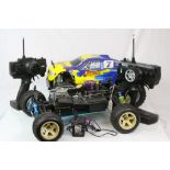 A Thunder Tiger Nitro 4WD Monster Truck together with a fuel monster truck chassis and two remote