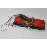 Huki of Germany tin plate Mercury convertible in red with remote control battery, circa 1950s,