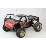 A Chevrolet Silverado Bigfoot fuel remote control car together with remote control.