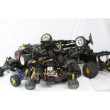 A collection of eight electric remote control car chassis.