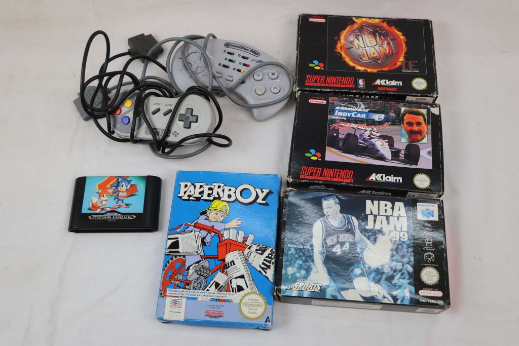 Retro Gaming - Four boxed games to include Nintendo NES Paperboy, Super Nintendo SNES NBA Jam TE,