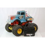 A original vintage 1990 Tamiya Bullhead Dual Motor, eight shock 4WD remote control truck together