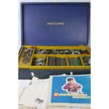 Boxed vintage Meccano set, to include base plates, pulleys, wheels etc together with instructions