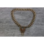 9ct gold curb link bracelet with padlock clasp and later safety chain
