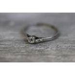 Diamond solitaire platinum ring, the round old cut diamond weighing approximately 0.25 carat, claw