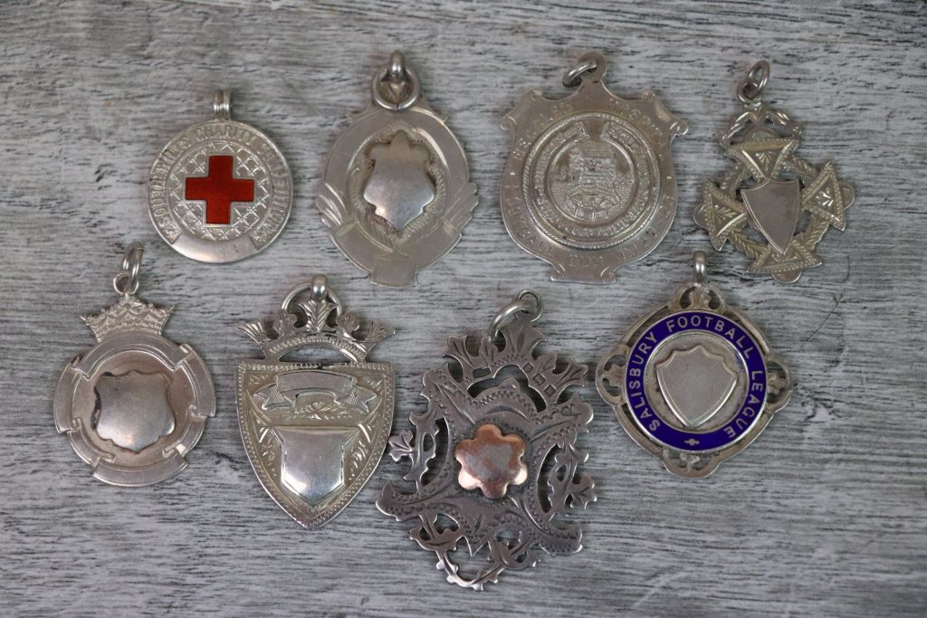 Eight silver fob medallions to include Edwardian and later, including Edwardian double sided