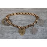 9ct gold curb link bracelet, each link stamped 9c, with 9ct gold padlock clasp and coin charms to