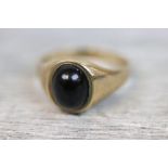 Black hardstone 9ct yellow gold ring, oval cabochon cut hardstone, rub over setting, plain