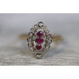 Art Deco style ruby and diamond 9ct gold ring, three graduated small round mixed cut rubies to