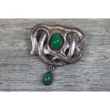 Art Nouveau chrysoprase unmarked silver brooch, the sinuous scroll design set with oval cabochon cut