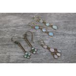 Pair of precious white opal yellow metal drop earrings, pair of precious white opal and emerald