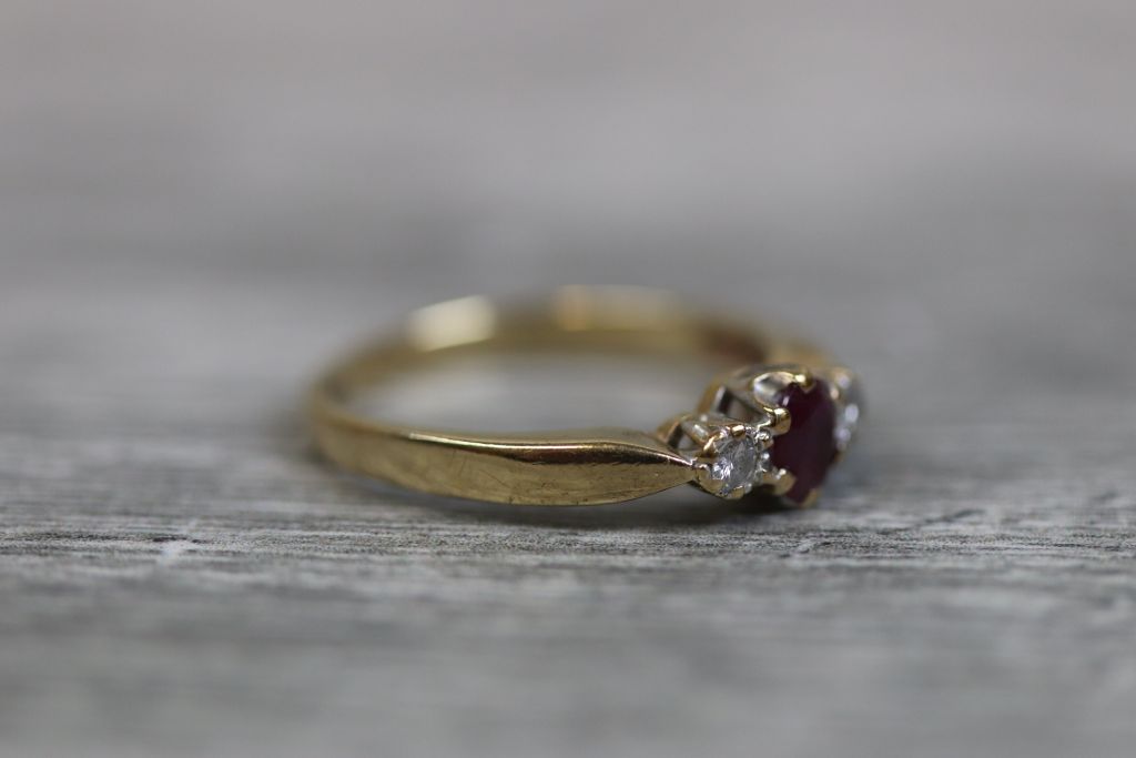 Ruby and diamond three stone 9ct yellow gold ring, the central oval mixed cut ruby measuring - Image 3 of 4