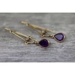 Pair of amethyst and seed pearl yellow metal earrings, the pear shaped mixed cut amethyst droplet