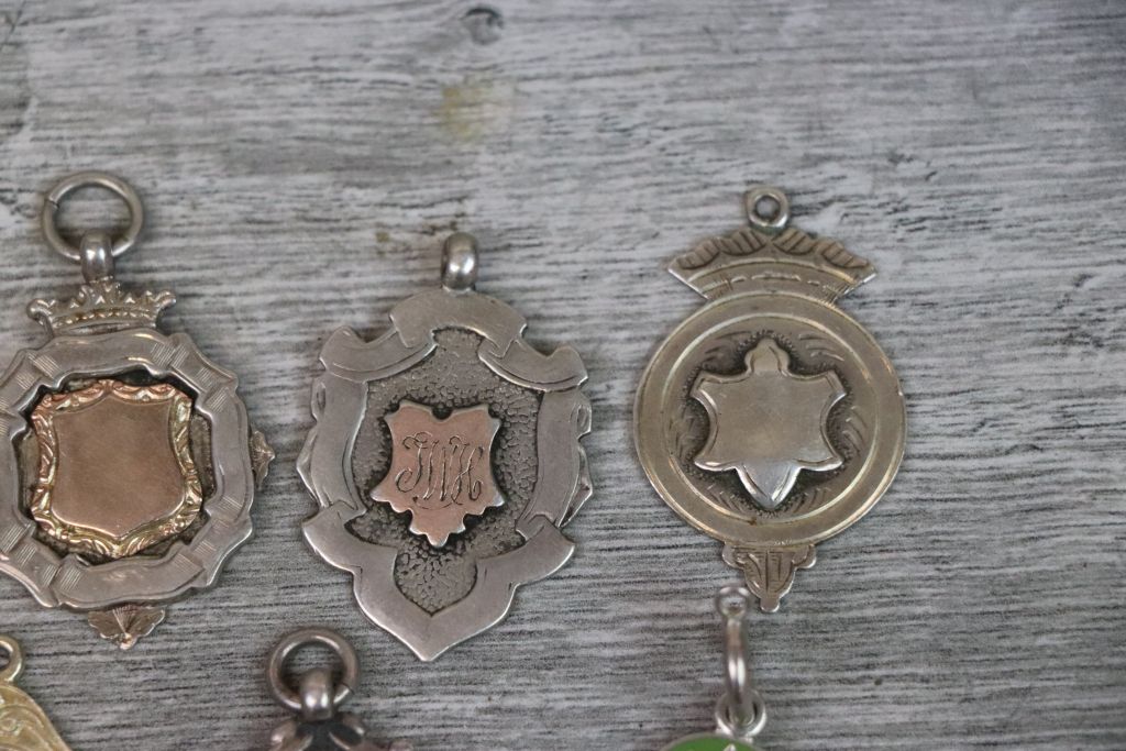 Nine silver fob medallions to include blank cartouches, enamelled Western Time Trials fob, Bagatelle - Image 5 of 7