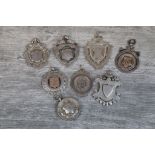Eight silver fob medallions to include blank cartouches; bass drummer fob, Perry Cup fob etc (8)