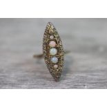 Early 20th century opal and diamond marquise ring, five graduated round cabochon cut precious