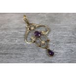 Edwardian amethyst and seed pearl 9ct yellow gold pendant necklace, central oval mixed cut