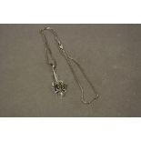 A silver plique a jour Art Nouveau style pendant necklace on silver chain