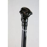 Ebonised walking stick, the handle in the form of a dolphin