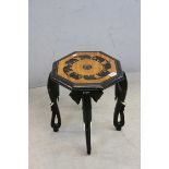 African Ebony and Mahogany Octagonal Side Table, inlaid with elephants and raised on four legs