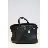 20th Century black textured Hermes bag of used condition