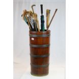 Large vintage coopered Wooden stick stand with a collection of mixed walking Sticks, Shooting