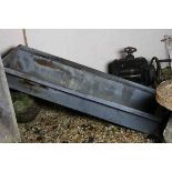 A vintage metal trough.