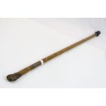 Scandanavian carved Hardwood walking Stick with heads to the finial and a white metal