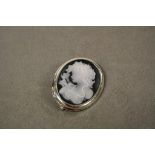 A silver cameo style brooch