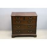 George III Mahogany Chest, with cross-banded top over Two Short and Three Long Drawers, raised on