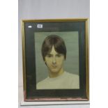 A framed portrait of Paul Weller.
