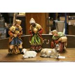 Nativity set, three wise men bearing gifts, donkey and sheep