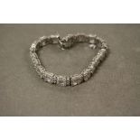 A silver and CZ substantial line bracelet