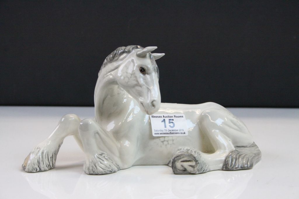 Beswick ceramic model of a Grey Shire Horse lying down, number 2459