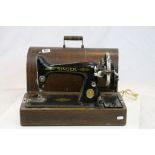 Vintage boxed Singer Sewing Machine and tin of vintage sewing Machine parts