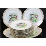 Set of 12 Veritable porcelain cabinet plates decorated with fish in a naturalistic setting, together