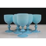 Six vintage Opaque blue Glass Goblets plus a larger example approx 16.5cm tall in the same style