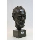 A 20th century bronze bust of a bearded man raised on a marble stand.