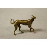 Bronze/brass sculpture of a dog, standing approx.5.5cm