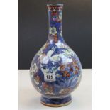 A 19th century Chinese bottle vase, decorated with birds, prunus & flowers, h: 35 cms