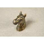 A brass vesta case in the form of a horse