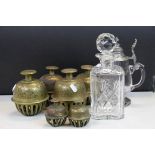 Five brass Asian temple bells with inlaid etched decoration, cut glass decanter and a glass lidded