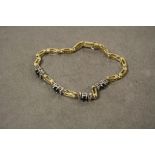 A 14ct yellow gold sapphire and diamond bracelet