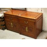 Pair of Chinese Hardwood Cabinets, each with single drawers above two panel doors with round