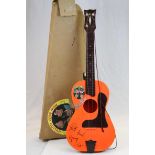 A vintage boxed beatles guitar with facsimile signatures